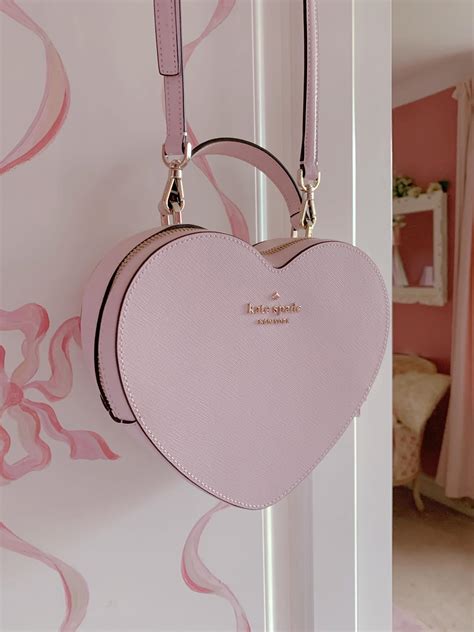 100 bought in past month. . Kate spade heart bag